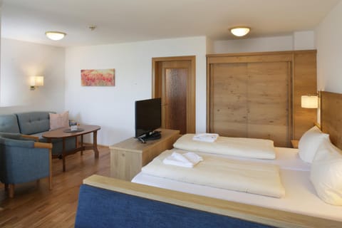 Bed, Seating area, wardrobe