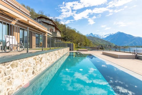 Property building, Nearby landmark, Spring, Day, Natural landscape, Lake view, Mountain view, Pool view, Swimming pool, sunbed