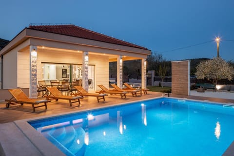 Property building, Patio, Night, Pool view, Swimming pool, sunbed