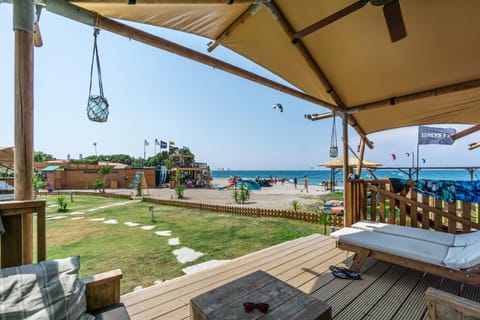 View (from property/room), Balcony/Terrace, Seating area, Beach