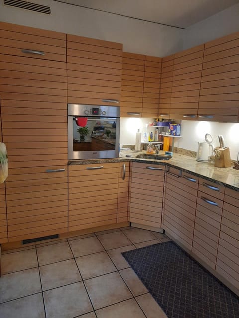 Kitchen or kitchenette, dishwasher, oven, stove