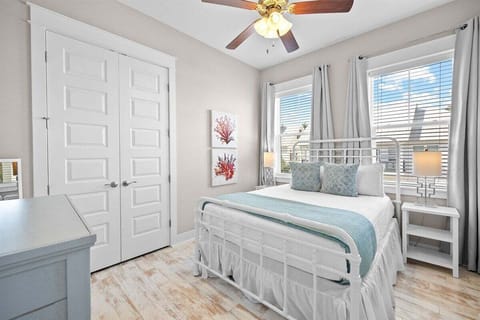 A beautifully designed room with large windows and inviting decor.