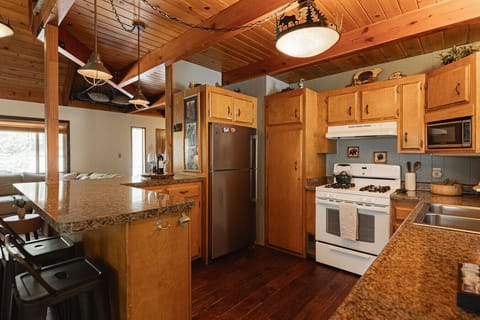 Breakfast bar and open concept kitchen makes meal time fun.