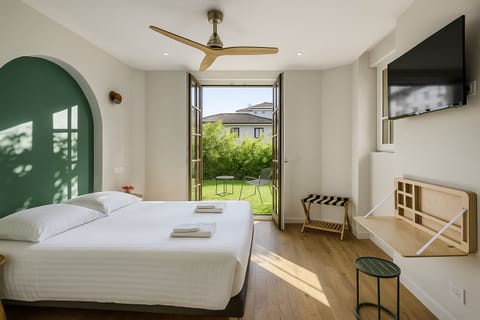 Double Room, Terrace, Ground Floor | Blackout drapes, iron/ironing board, free WiFi, bed sheets