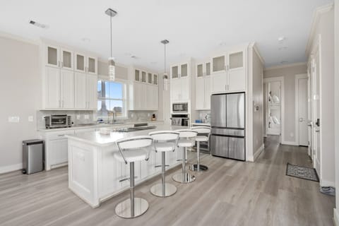 Modern kitchen with large island, plenty of storage and amenities