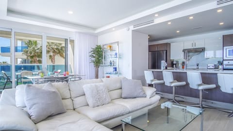 The full main open living room space including dining area and kirtchen.