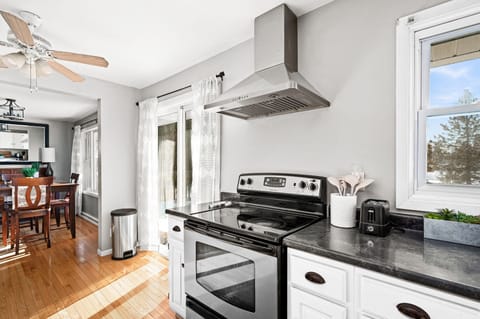 The sliding doors lead to the back where you can enjoy the peaceful backyard.