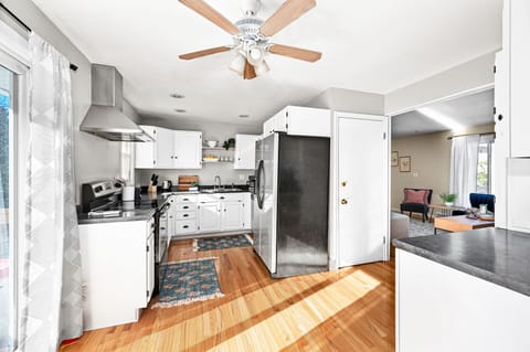 Fully-stocked upstairs kitchen.