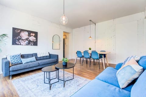 Spacious and modern living room with comfy sofas.