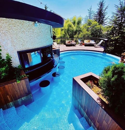 2 outdoor pools, pool umbrellas, lifeguards on site