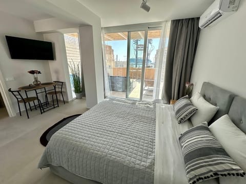 Deluxe Double Room | Living area | 50-inch Smart TV with digital channels