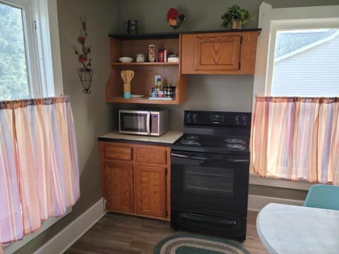 Full kitchen with microwave, coffee/tea area