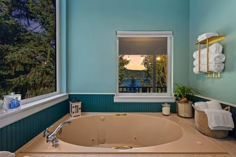 Soak in a tub surrounded by nature with the large picture window!