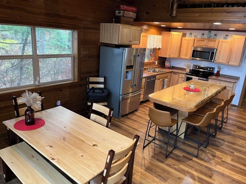 Seating: 6 island & 6 dining table. Patio dining & grill too.