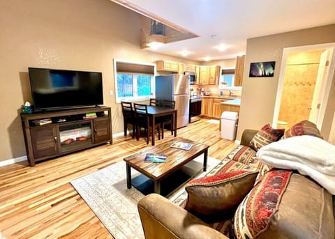 Living Room with Smart TV looking into Full Kitchen