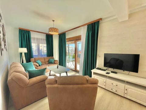Deluxe Villa | Living area | 32-inch LCD TV with cable channels