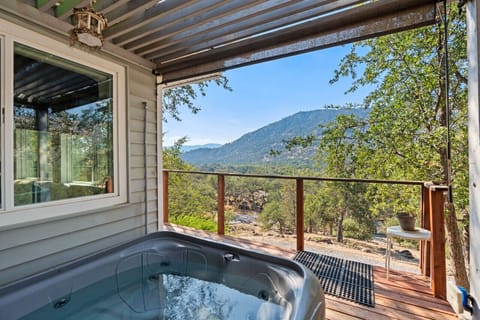 Relax in the hot tub while looking over the sierra mountains and listen to the north fork river below