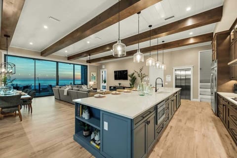 Great Room - Open Floor Plan - Fully Stocked Kitchen, Dining for 8 and Bar seating for 4 - Balcony Access - Gulf Views