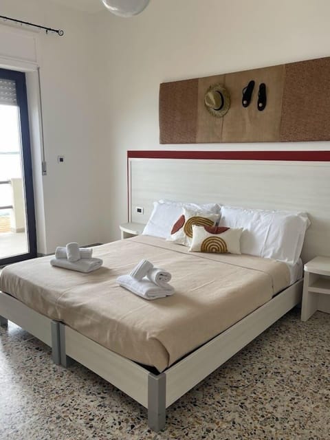 Panoramic Triple Room | Minibar, in-room safe, desk, blackout drapes