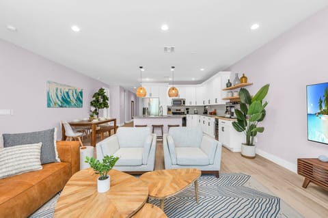 The warm lighting and carefully chosen decor invite you to relax and unwind, setting the stage for an unforgettable stay in this meticulously designed Airbnb. Enjoy watching your "bingeable" shows on the large ROKU TV, or embrace the views of the pool.