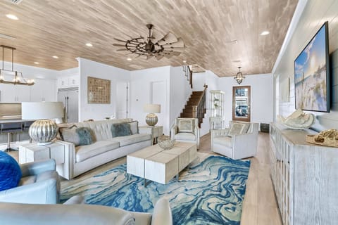Featuring a spacious great room, private access to the pool pavilion, and expansive suites and covered balconies.