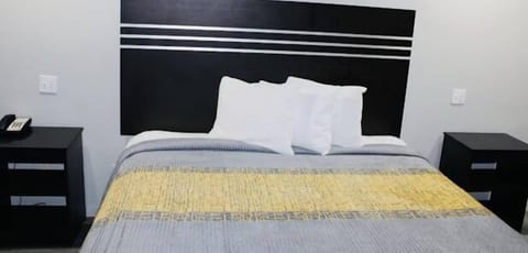 Room, 1 King Bed, Non Smoking | Desk, iron/ironing board, free WiFi, bed sheets