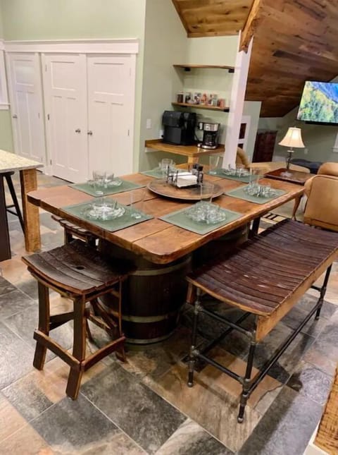 Rustic oak barrel high top table with 4 stools and a bench. Easily seats 6-8.
