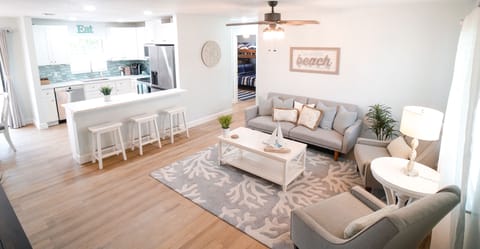Our spacious & comfortable nautical-themed living room & fully-equipped kitchen