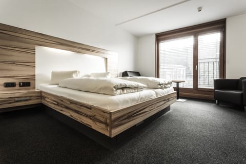 Hypo-allergenic bedding, desk, blackout drapes, iron/ironing board