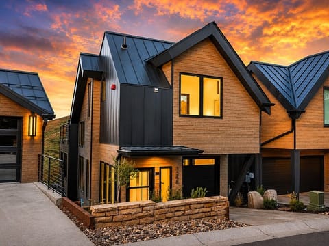 Welcome to your modern mountain retreat. Arrive to warm exterior lighting, dramatic sunset views, and a stylish alpine setting designed for a comfortable Park City stay.