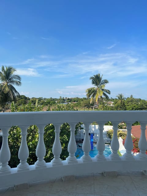 Deluxe Room, Balcony, Pool View | Individually decorated, individually furnished, desk, laptop workspace