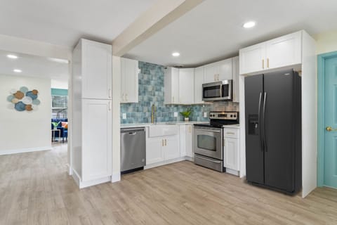 The open kitchen design has plenty of room to prepare meals. The perfect place to entertain family and friends. REFRIGERATOR INCLUDED but was not delivered prior to picture day.