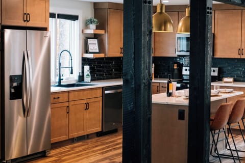 Full Kitchen equipped with dishes, glassware, utensils, pots and pans, and other misc. items you may need.-