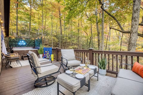Sink into your private hot tub after a full day on the trails — outdoor furniture, cornhole, and an evening fire waiting just steps away.