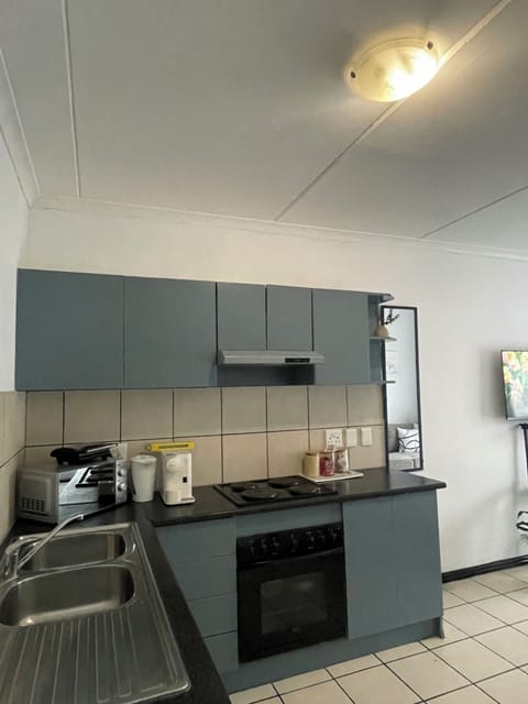 Full kitchen with dining plates, dishes and glasses coffe station