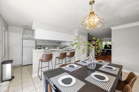 Dining area seats 6 plus island bar seating—great for shared meals and group hangouts