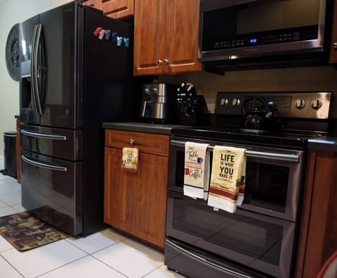 Fully stocked kitchen - equipped with dishwasher, microwave, coffee maker, tea kettle, pots and pans. (3)