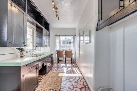 Lovely kitchen with plenty of counter space and dining table for two