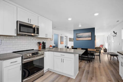 The kitchen at this rental is well stocked with up to date amenities and has ample counter space.