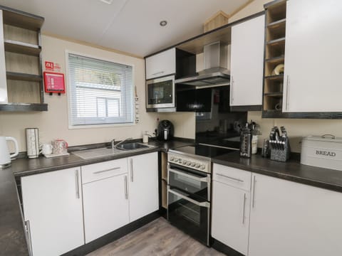 Fridge, electric kettle, toaster, cookware/dishes/utensils