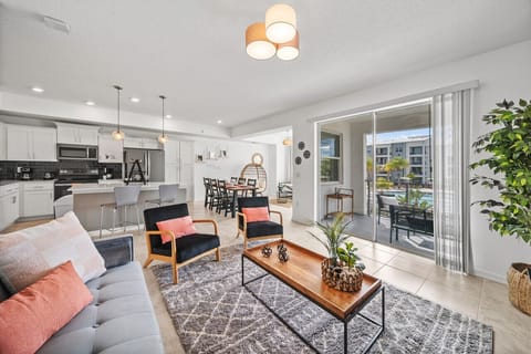 Living Room with Pool View#Disney #Parks #kingdom #springs #StoreyLake #resort #Apartment #Vacation #Rental #waterpark #Kissimmee #Orlando #universal #citywalk