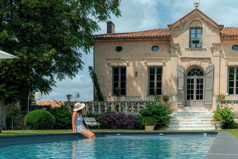 Seasonal outdoor pool, open 10:00 AM to 8:00 PM, pool umbrellas