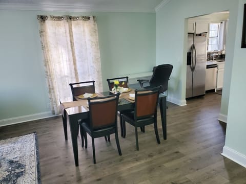 Dedicated dining table for 4. Could seat 6 with additional chairs.