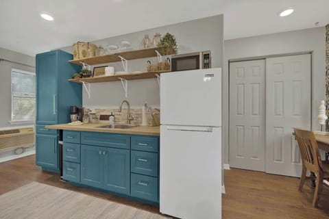 Kitchenette stocked with necessities in the pool house.