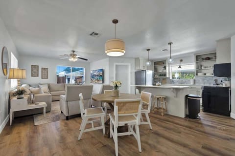 Seating for four at the table plus three at the bar.