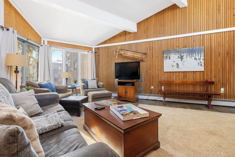 Living room with vaulted ceilings and plenty of seating