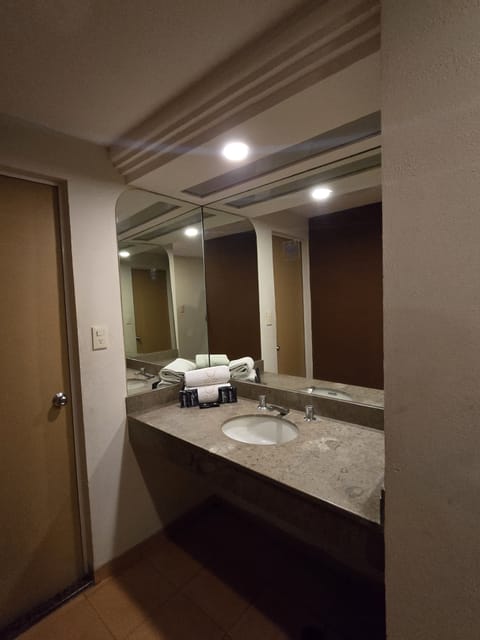 Quadruple Room | Bathroom | Shower, towels, soap, shampoo