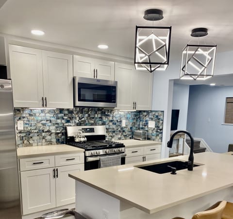 Fully stocked eat in kitchen.