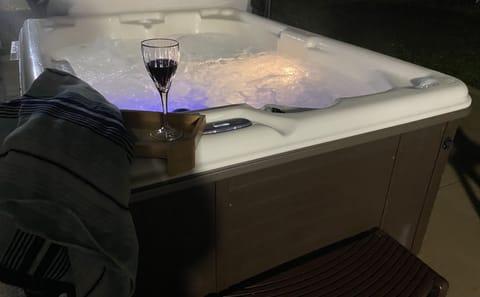 Hot tub located on back patio 