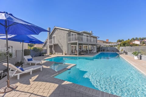 75' pool and jacuzzi with lounge and table seating